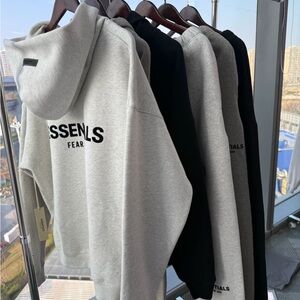 Fear of God Essentials Light Gray and Black Hoodies